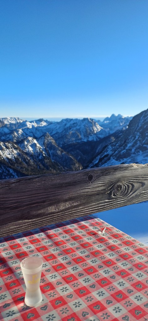A shot of grappa with a mountain view behind